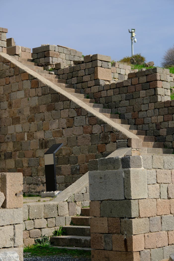 Home Explore ancient stone ruins in Bergama, İzmir, Türkiye on a sunny day.